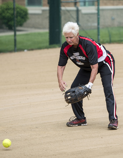 Photo of Jan fielding a ball at 3rd base w/ Link to Jan's story