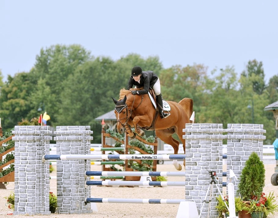 Dr. Boggus competing on an equestrian course